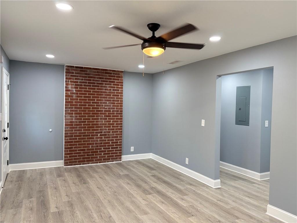 1546 Alverado Way Decatur, GA 30032 - Photo 3 of 17 an empty room with ceiling fan and wooden floor