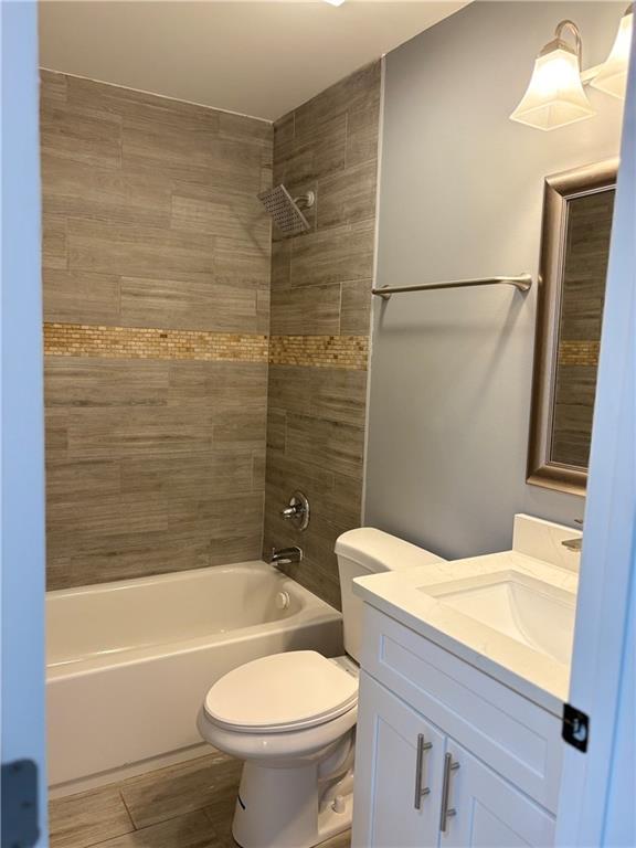 1546 Alverado Way Decatur, GA 30032 - Photo 10 of 17 a bathroom with a sink a toilet and bathtub