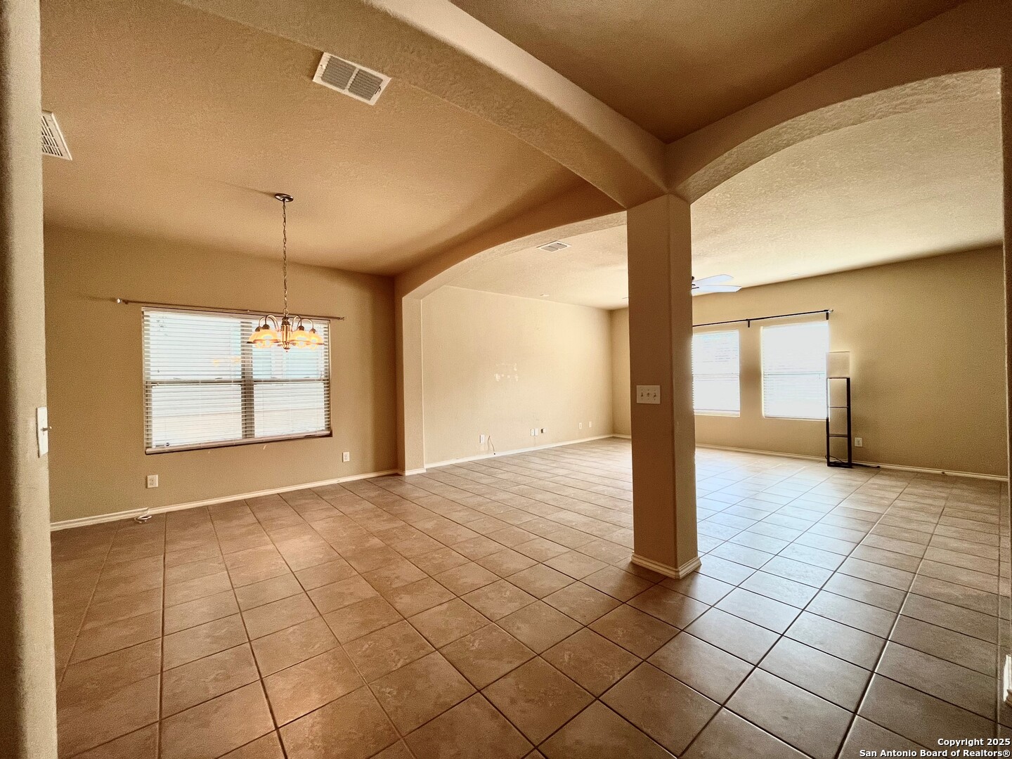 426 Tequila Ranch San Antonio, TX 78245 - Photo 8 of 24 a view of a hallway with wooden floor and a window