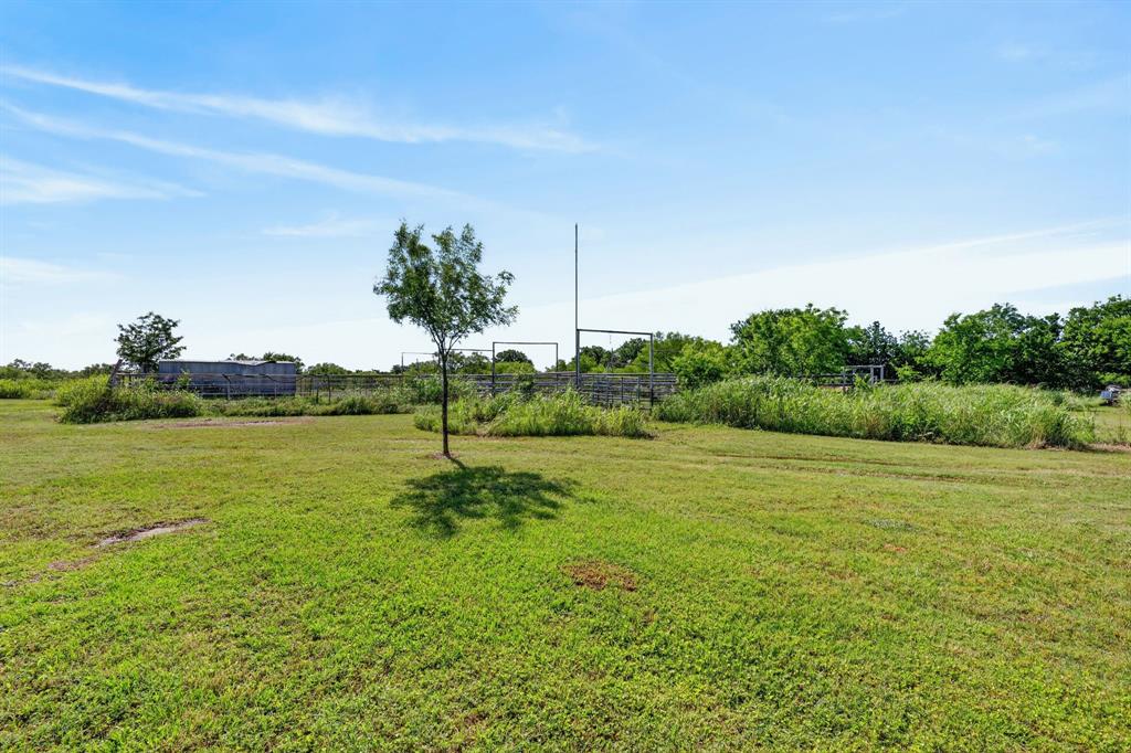 2401 Lamkin Road Mineral Wells, TX 76067 - Photo 26 of 36 a view of a field with an ocean