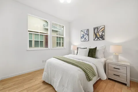 a bedroom with a bed and a window