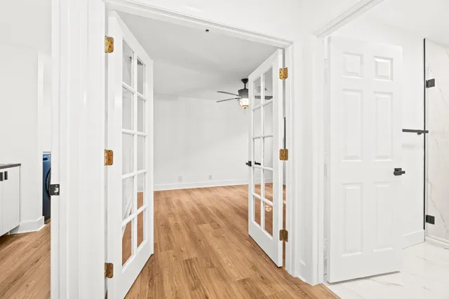 a view of a hallway with a white walls