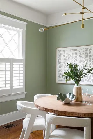 a kitchen with a sink a potted plant and a window