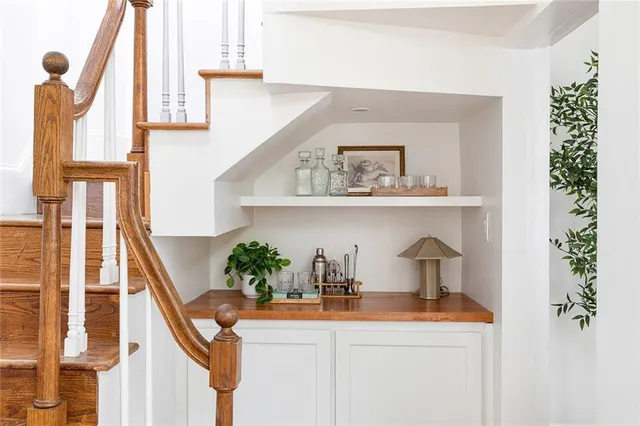 a bedroom with furniture and a fireplace
