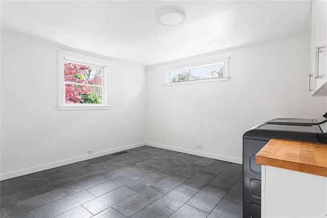 a bedroom with a bed and a potted plant