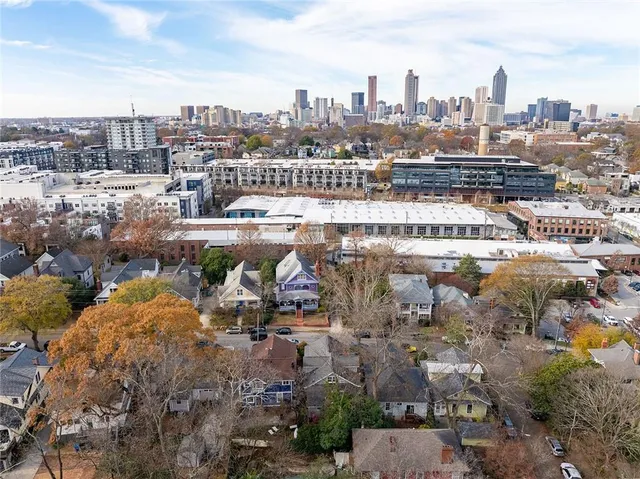 a view of a cafe with a table and chairs under an umbrella
