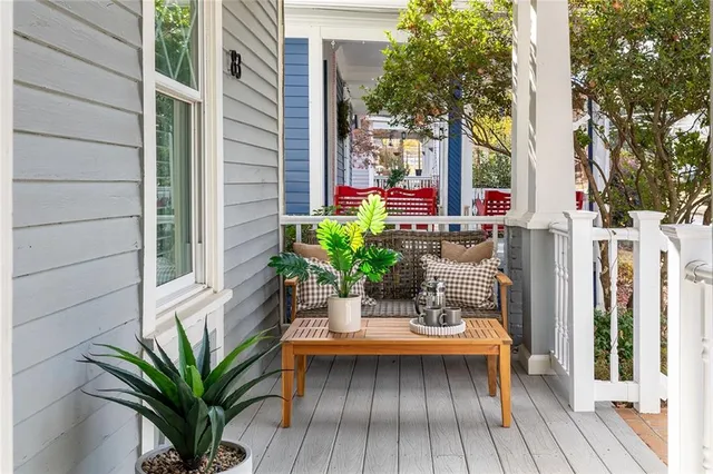 a living room with furniture two window and a fireplace