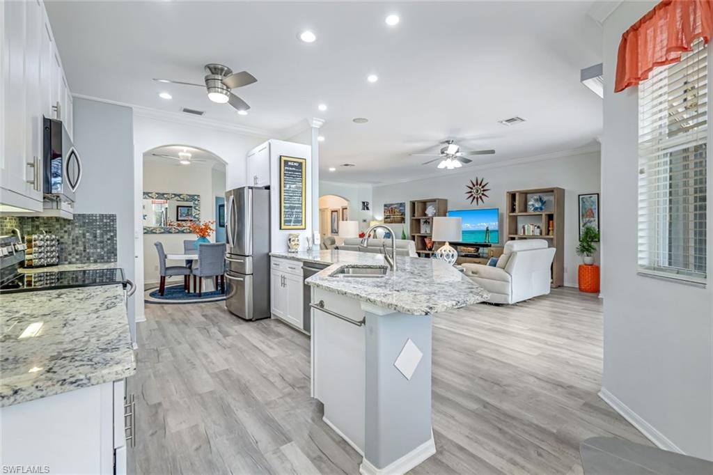 20050 Rookery Drive Estero, FL 33928 - Photo 15 of 45 a kitchen with counter space cabinets and appliances