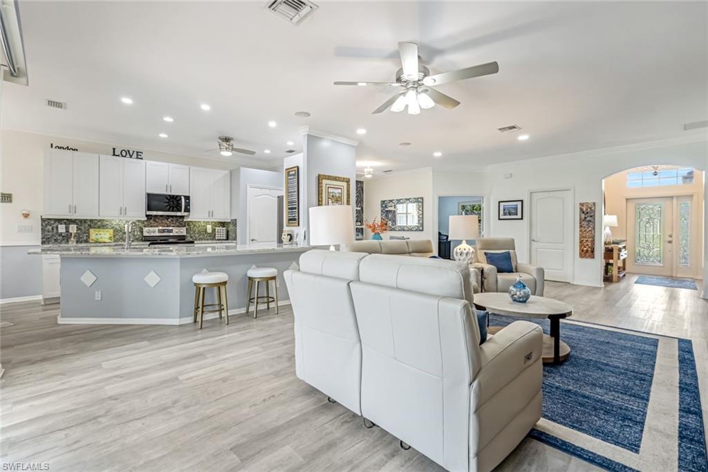 20050 Rookery Drive Estero, FL 33928 - Photo 17 of 45 a living room with furniture and kitchen view