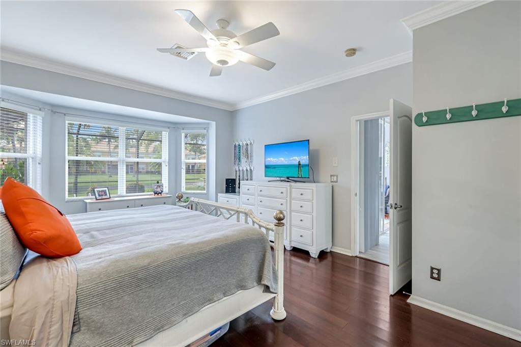 20050 Rookery Drive Estero, FL 33928 - Photo 19 of 45 a bed room with a bed and a chair