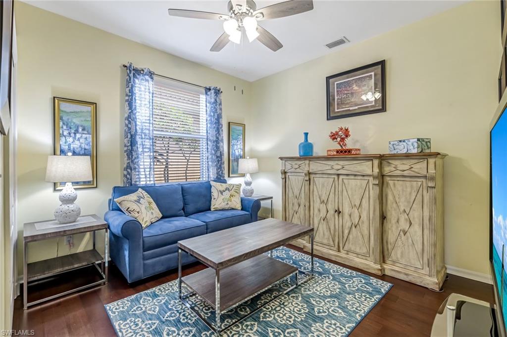 20050 Rookery Drive Estero, FL 33928 - Photo 23 of 45 a living room with furniture and a rug