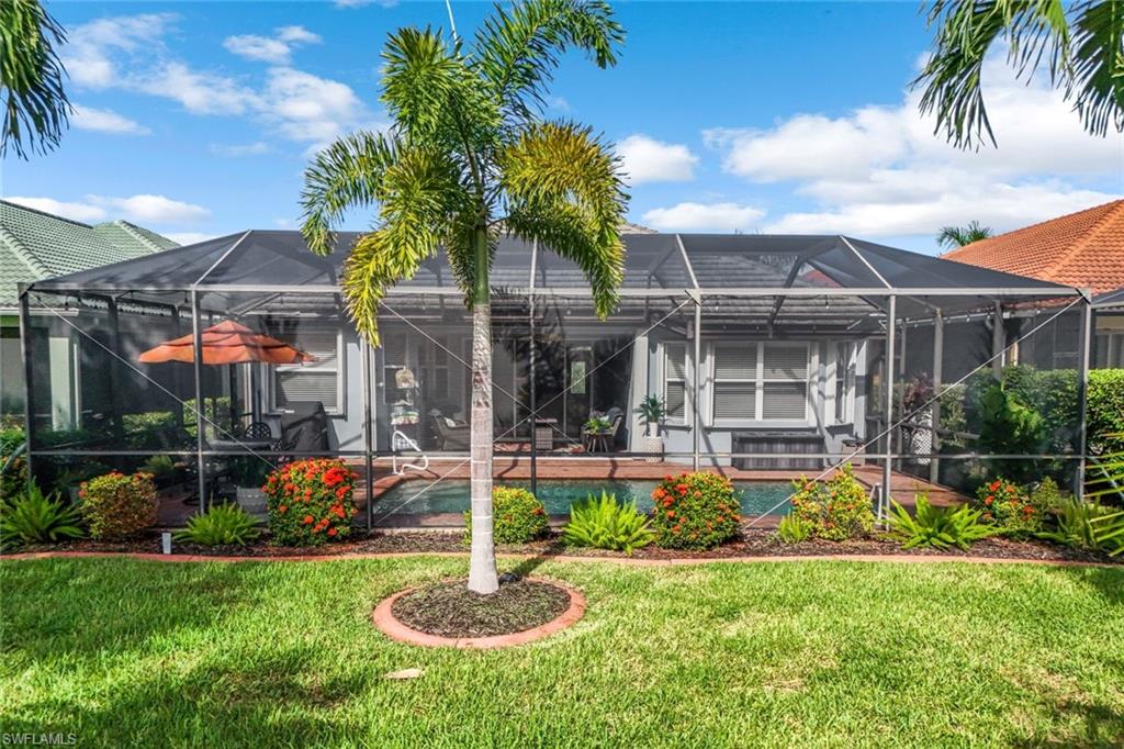 20050 Rookery Drive Estero, FL 33928 - Photo 28 of 45 a front view of a house with swimming pool having outdoor seating