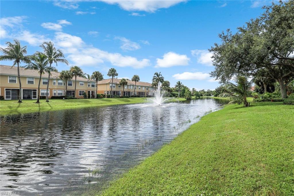 20050 Rookery Drive Estero, FL 33928 - Photo 30 of 45 a view of a lake with houses in the background