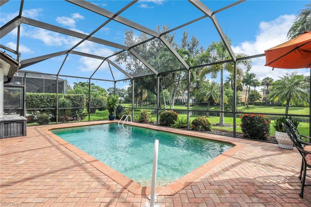 20050 Rookery Drive Estero, FL 33928 - Photo 33 of 45 a view of a backyard with a swimming pool