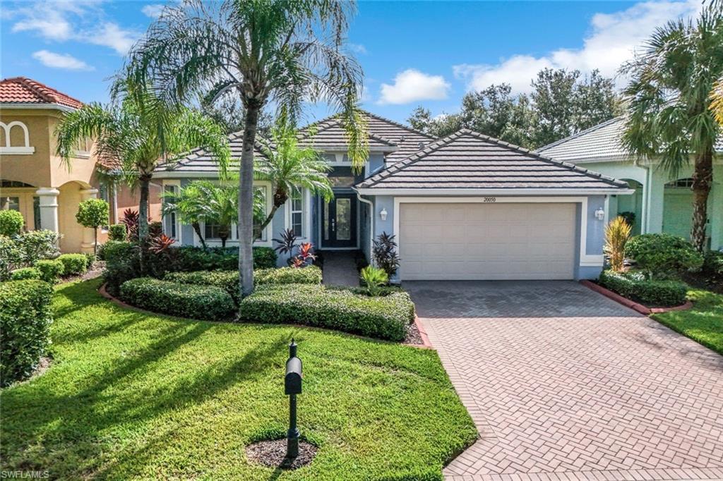 20050 Rookery Drive Estero, FL 33928 - Photo 35 of 45 a front view of a house with a yard
