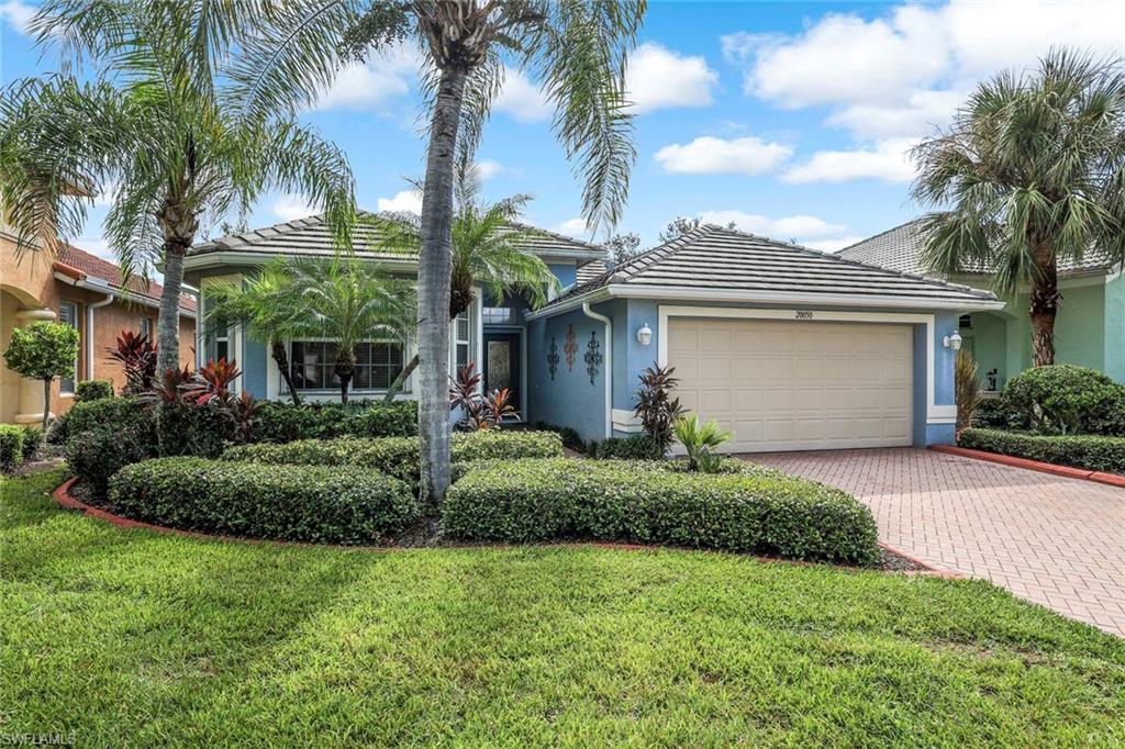 20050 Rookery Drive Estero, FL 33928 - Photo 36 of 45 a view of a house with a yard and palm trees