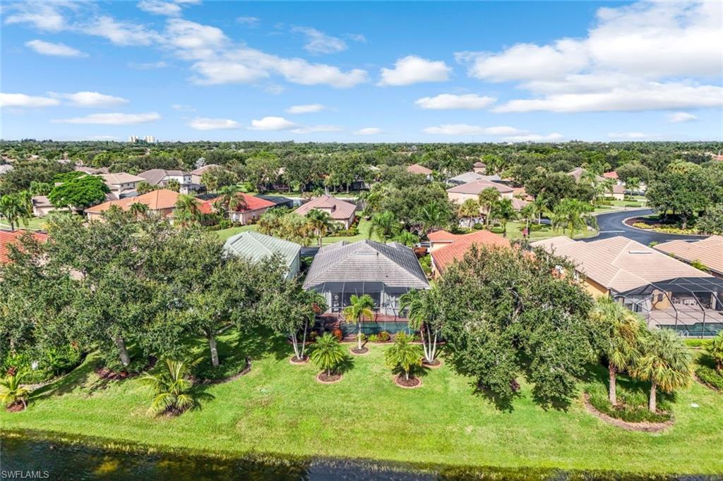 20050 Rookery Drive Estero, FL 33928 - Photo 45 of 45 an aerial view of a house with garden space and trees