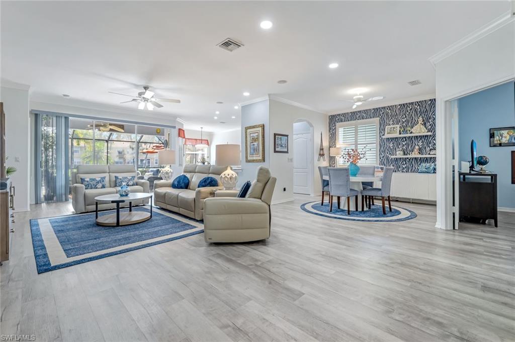 20050 Rookery Drive Estero, FL 33928 - Photo 6 of 45 a living room with furniture and wooden floor