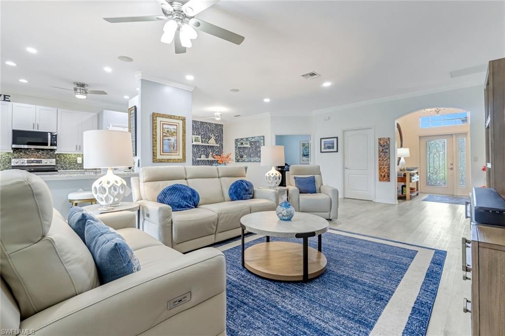 20050 Rookery Drive Estero, FL 33928 - Photo 7 of 45 a living room with furniture and a wooden floor