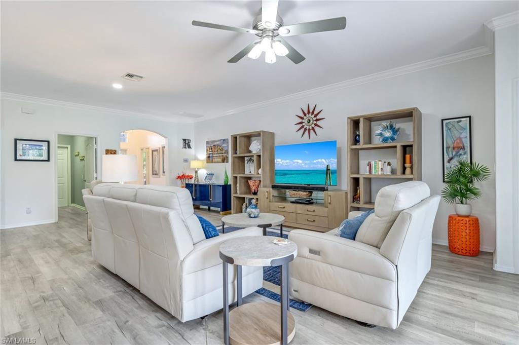 20050 Rookery Drive Estero, FL 33928 - Photo 8 of 45 a living room with furniture and a lamp