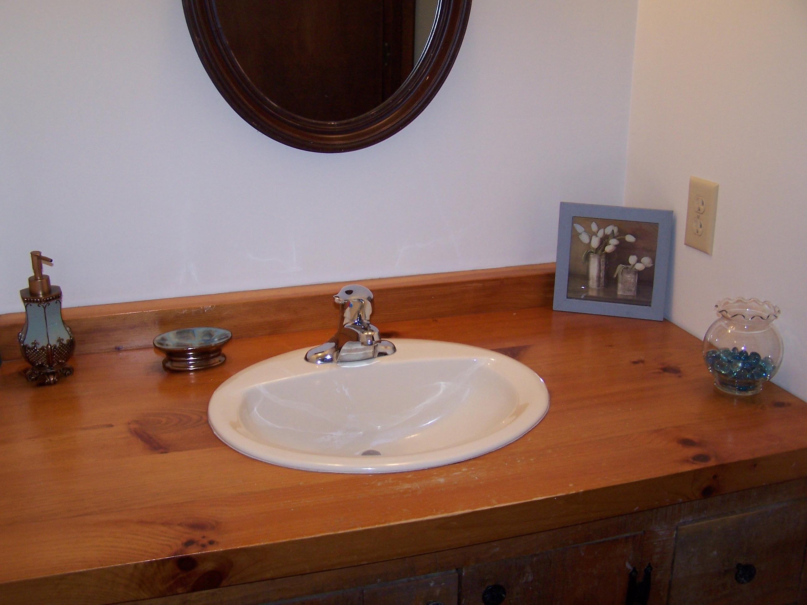 219 W Road Blue Ridge, VA 24064 - Photo 12 of 25 a bathroom with a sink and a mirror