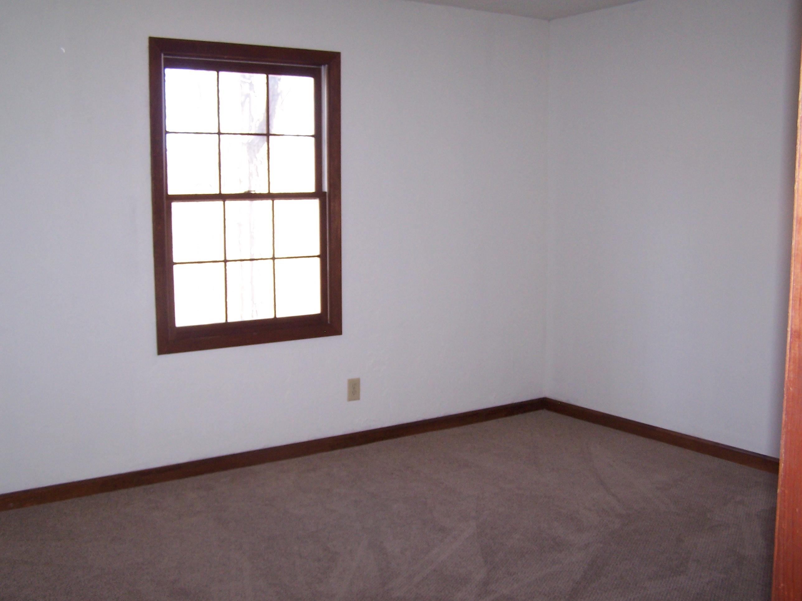 219 W Road Blue Ridge, VA 24064 - Photo 14 of 25 an empty room with a window