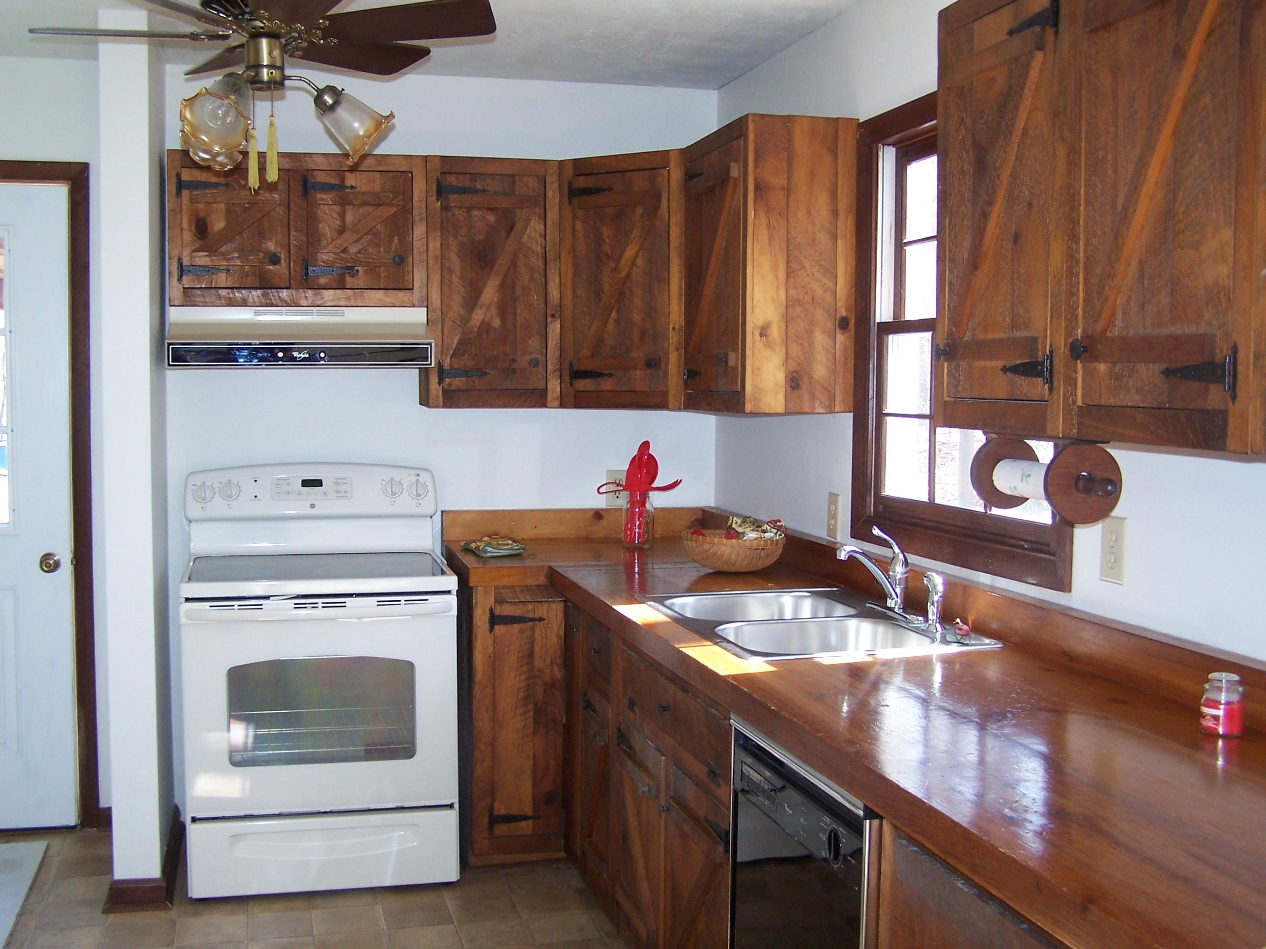 219 W Road Blue Ridge, VA 24064 - Photo 7 of 25 a kitchen with a sink stove and cabinets