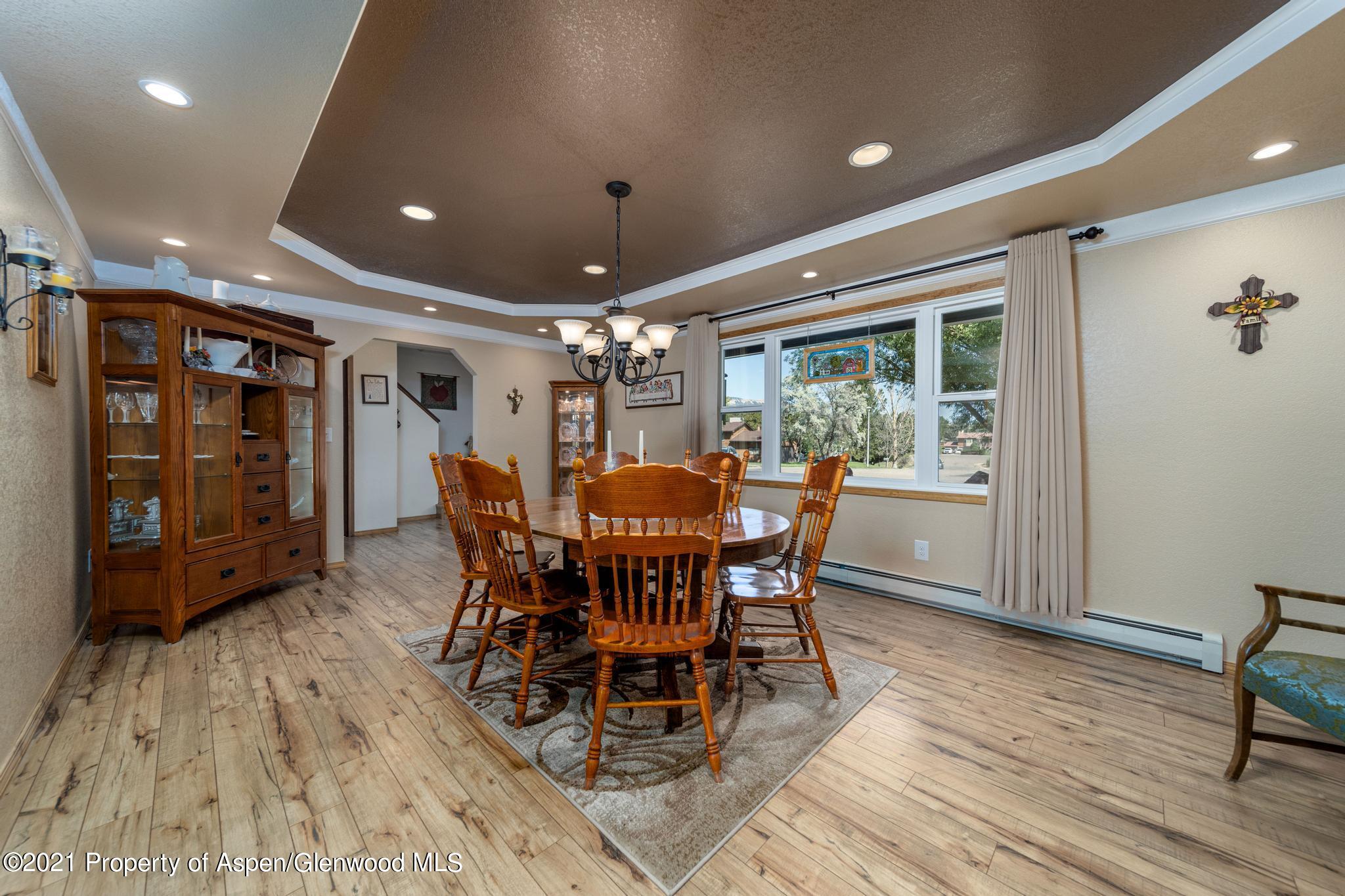 737 Cactus Court Rifle, CO 81650 - Photo 8 of 24 a view of a dining room with furniture window and wooden floor