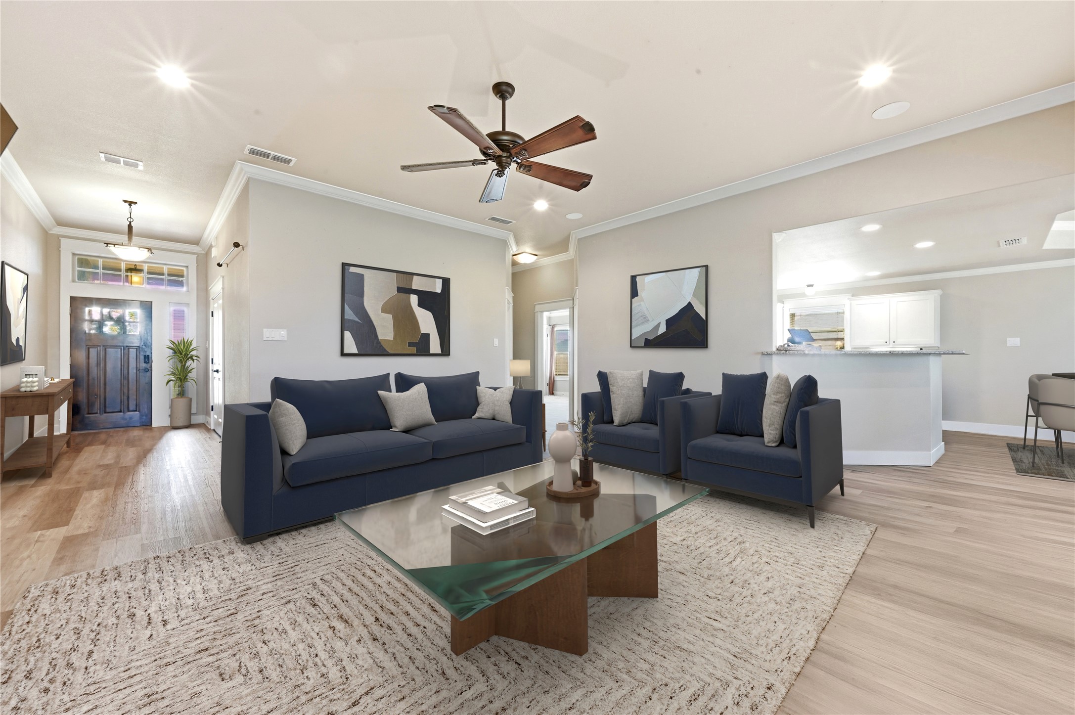 4467 West Amity Road Salado, TX 76571 - Photo 11 of 40 This inviting living space features light-colored flooring, crown molding, and a ceiling fan for comfort