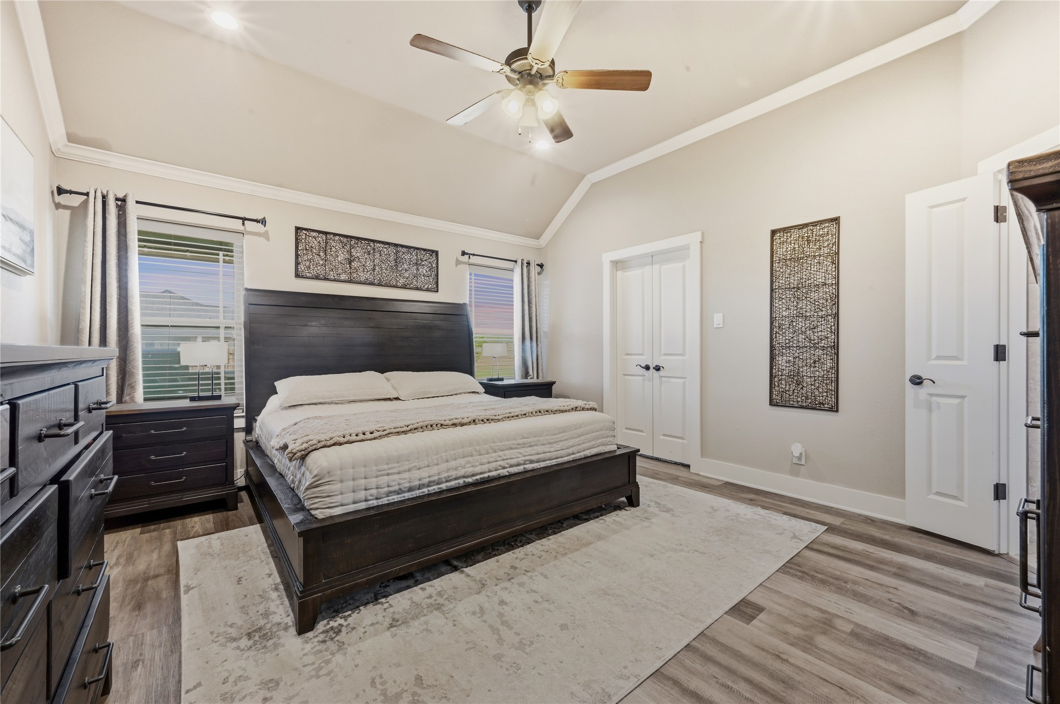 4467 West Amity Road Salado, TX 76571 - Photo 17 of 40 This bedroom features vaulted ceilings, light wood-style flooring, and a ceiling fan