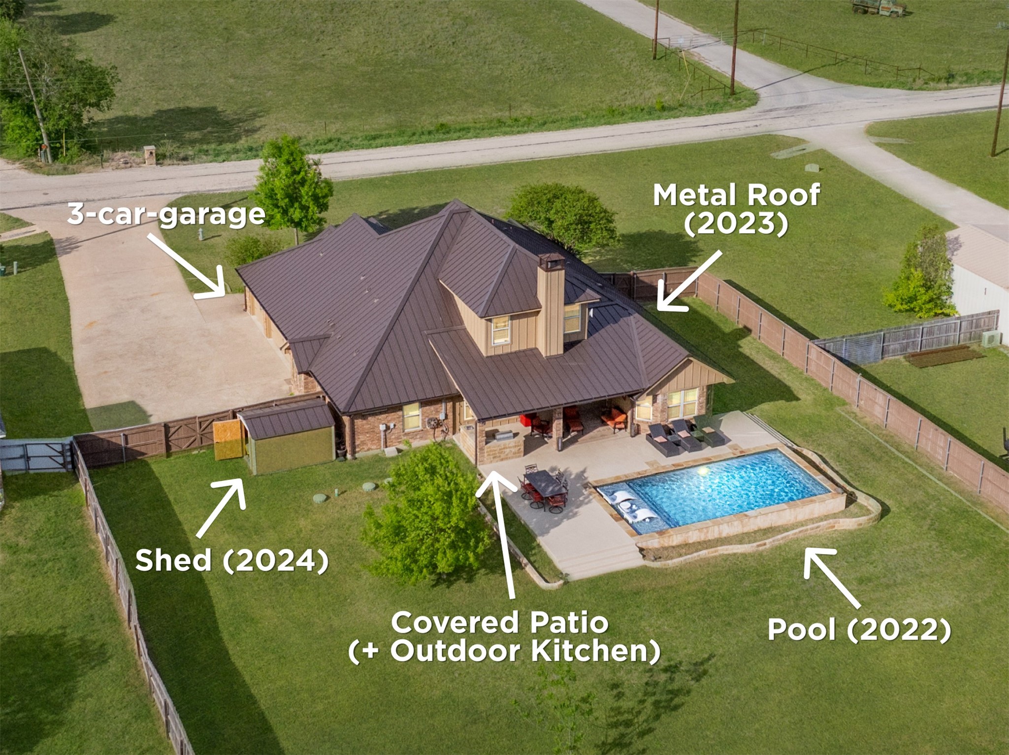 4467 West Amity Road Salado, TX 76571 - Photo 2 of 40 This property features a metal roof, a 3-car garage, a shed, a covered patio with an outdoor kitchen, and a pool