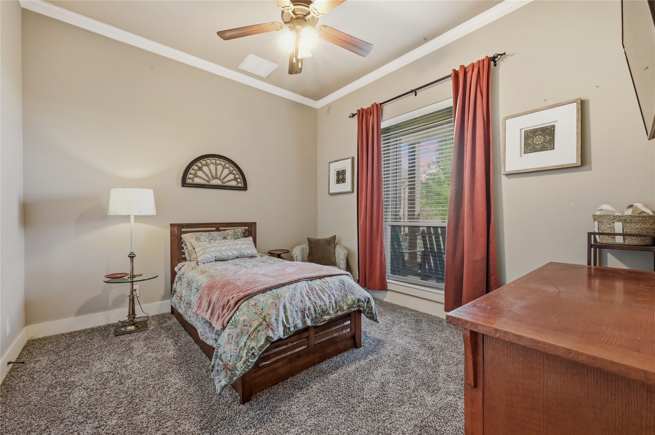 4467 West Amity Road Salado, TX 76571 - Photo 25 of 40 This room features a ceiling fan, crown molding, and carpeting