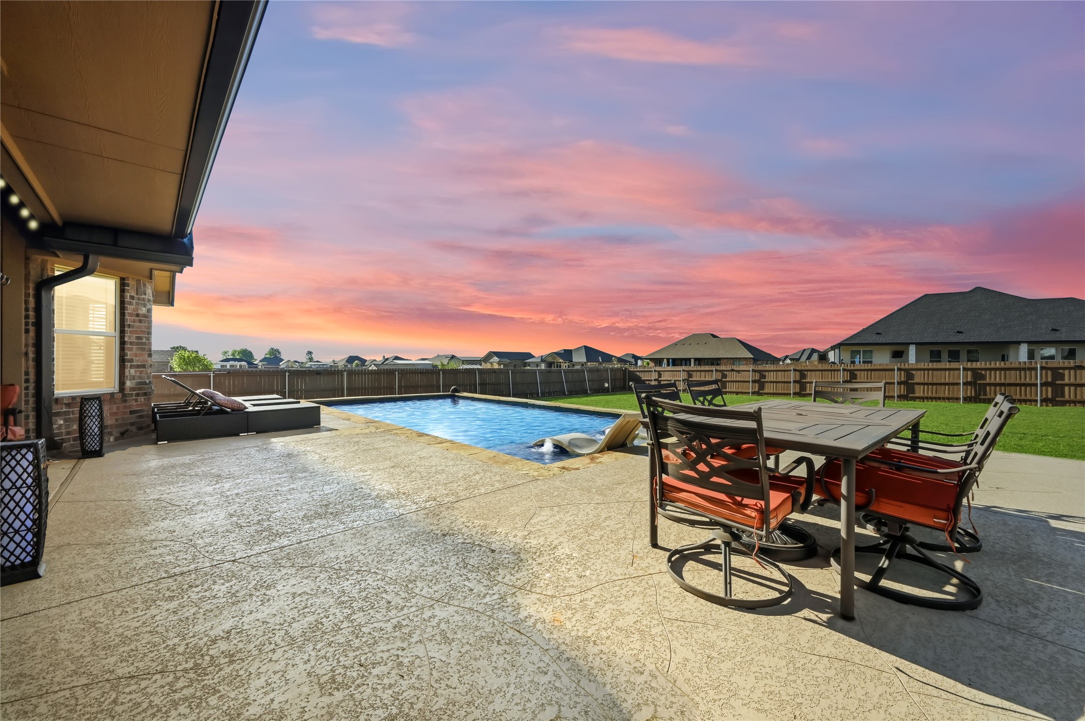 4467 West Amity Road Salado, TX 76571 - Photo 32 of 40 The property features an outdoor patio with a swimming pool, a lawn, and a wooden fence