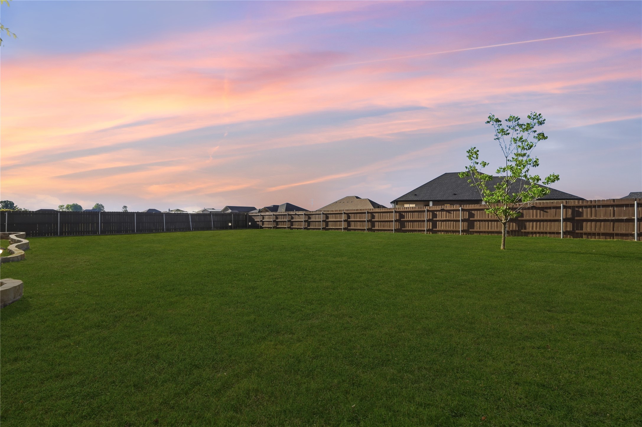 4467 West Amity Road Salado, TX 76571 - Photo 37 of 40 The property features an extensive lawn with a wooden fence enclosing the perimeter