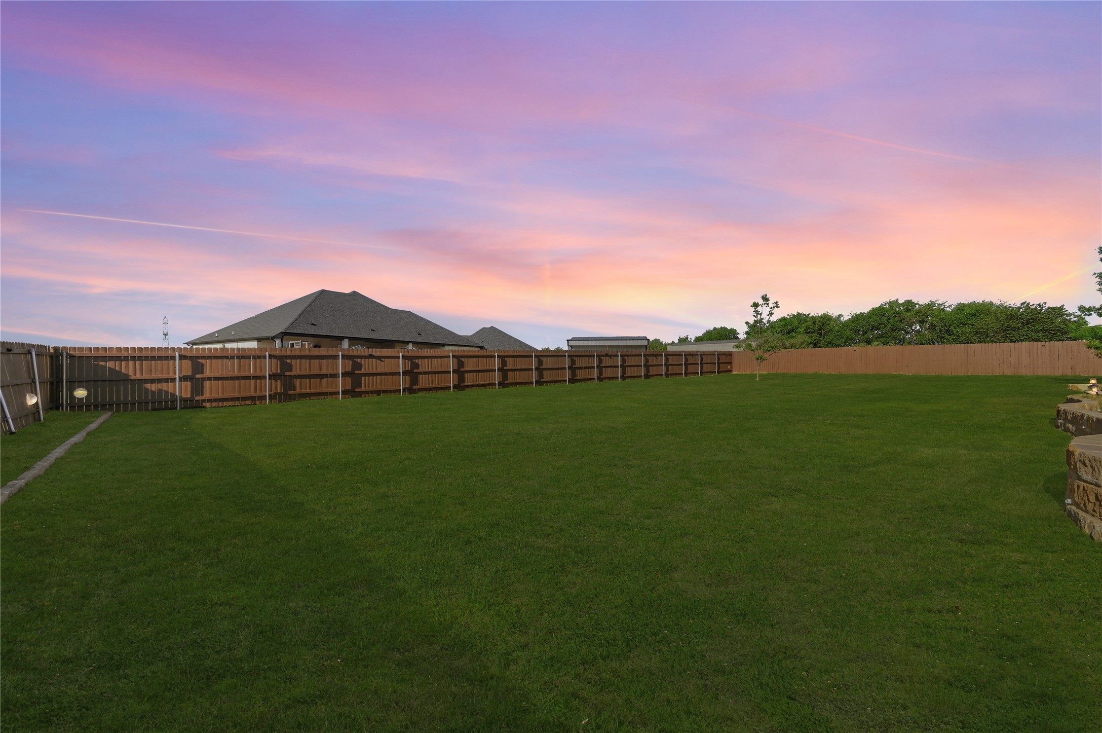 4467 West Amity Road Salado, TX 76571 - Photo 39 of 40 The property features an extensive, well-maintained lawn, enclosed by a wooden privacy fence