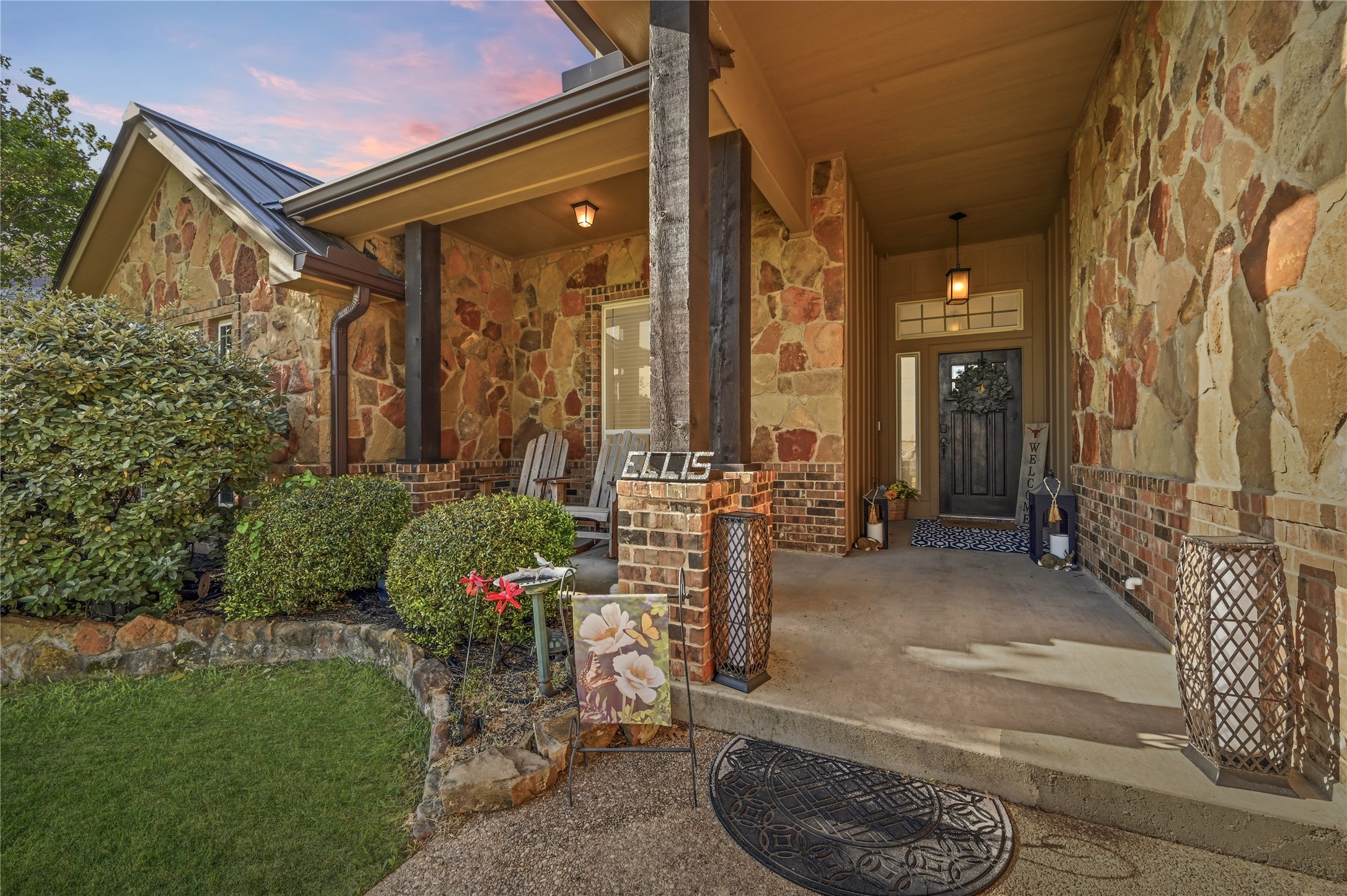 4467 West Amity Road Salado, TX 76571 - Photo 7 of 40 The property features an inviting front porch with stone and brick accents, supported by substantial wooden columns