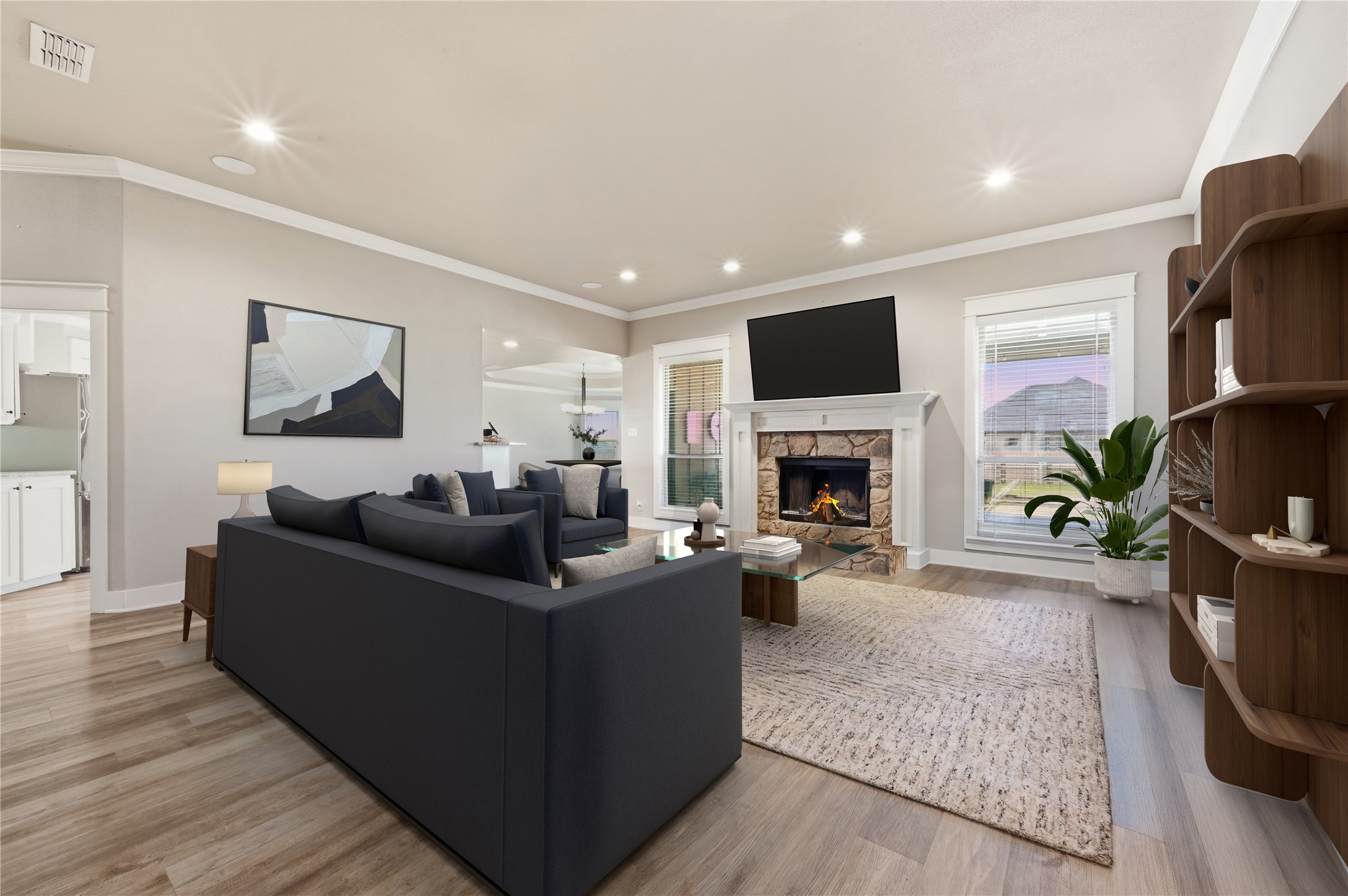 4467 West Amity Road Salado, TX 76571 - Photo 10 of 40 The living area features light wood flooring, a stone fireplace with a white mantel, and recessed lighting