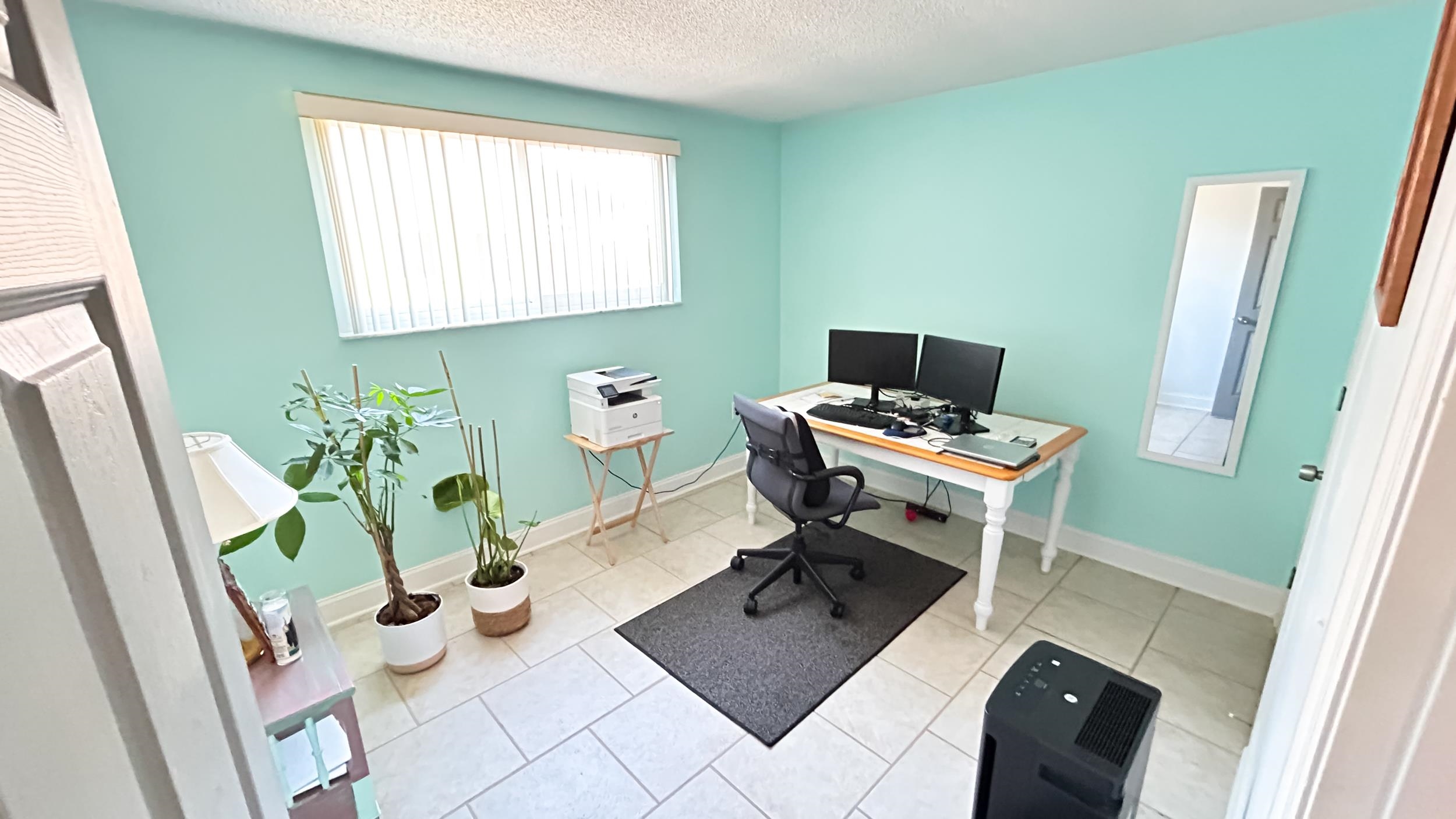 320 3rd Street North Flagler Beach, FL 32136 - Photo 13 of 29 a view of a workspace with furniture and a window