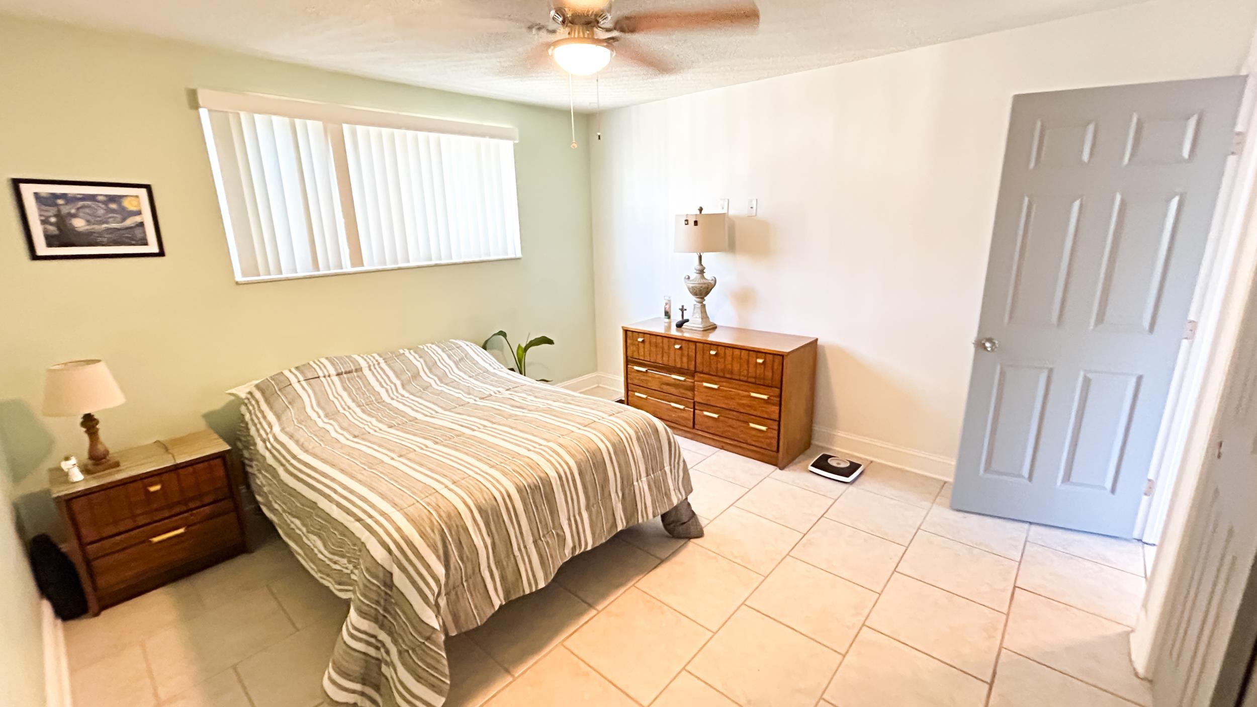 320 3rd Street North Flagler Beach, FL 32136 - Photo 20 of 29 a bedroom with a bed and a window