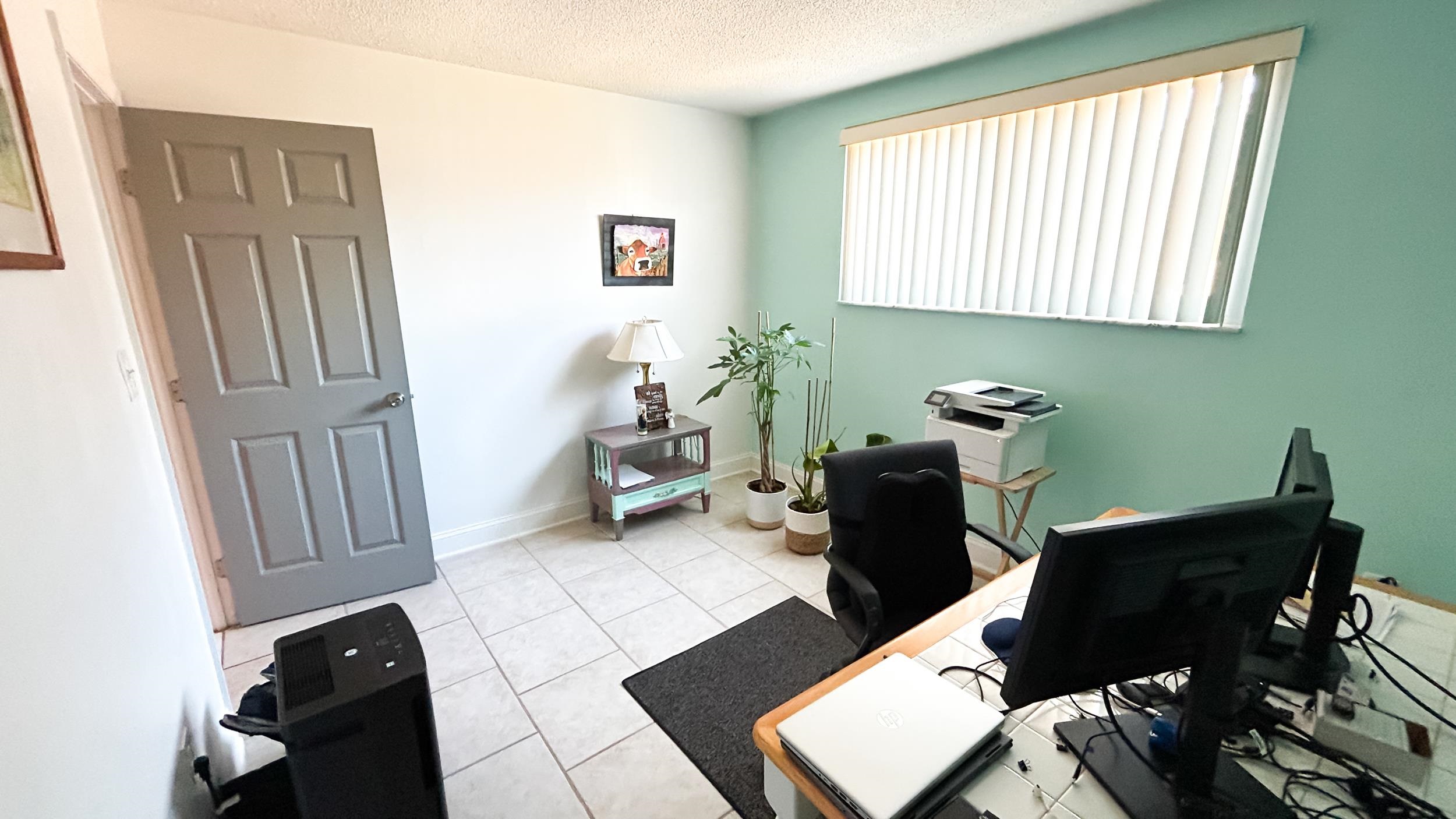 320 3rd Street North Flagler Beach, FL 32136 - Photo 21 of 29 a view of a workspace with furniture and a window