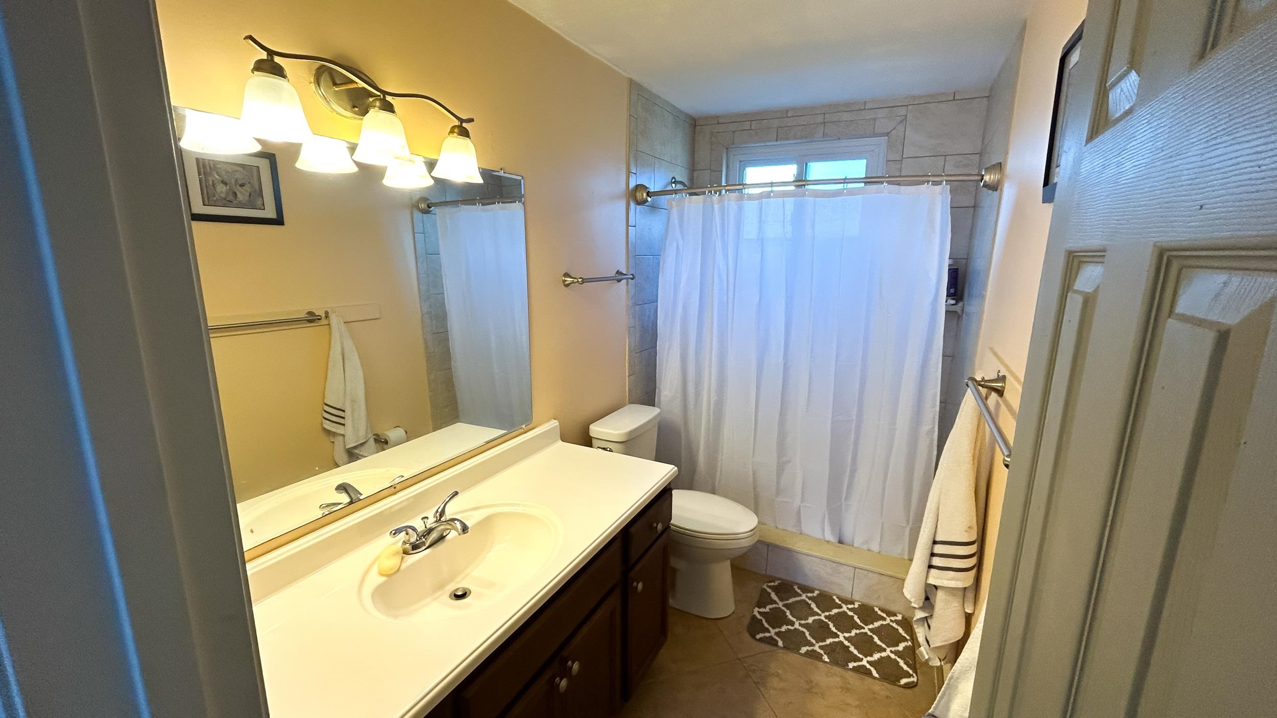 320 3rd Street North Flagler Beach, FL 32136 - Photo 22 of 29 a bathroom with a sink a toilet and shower