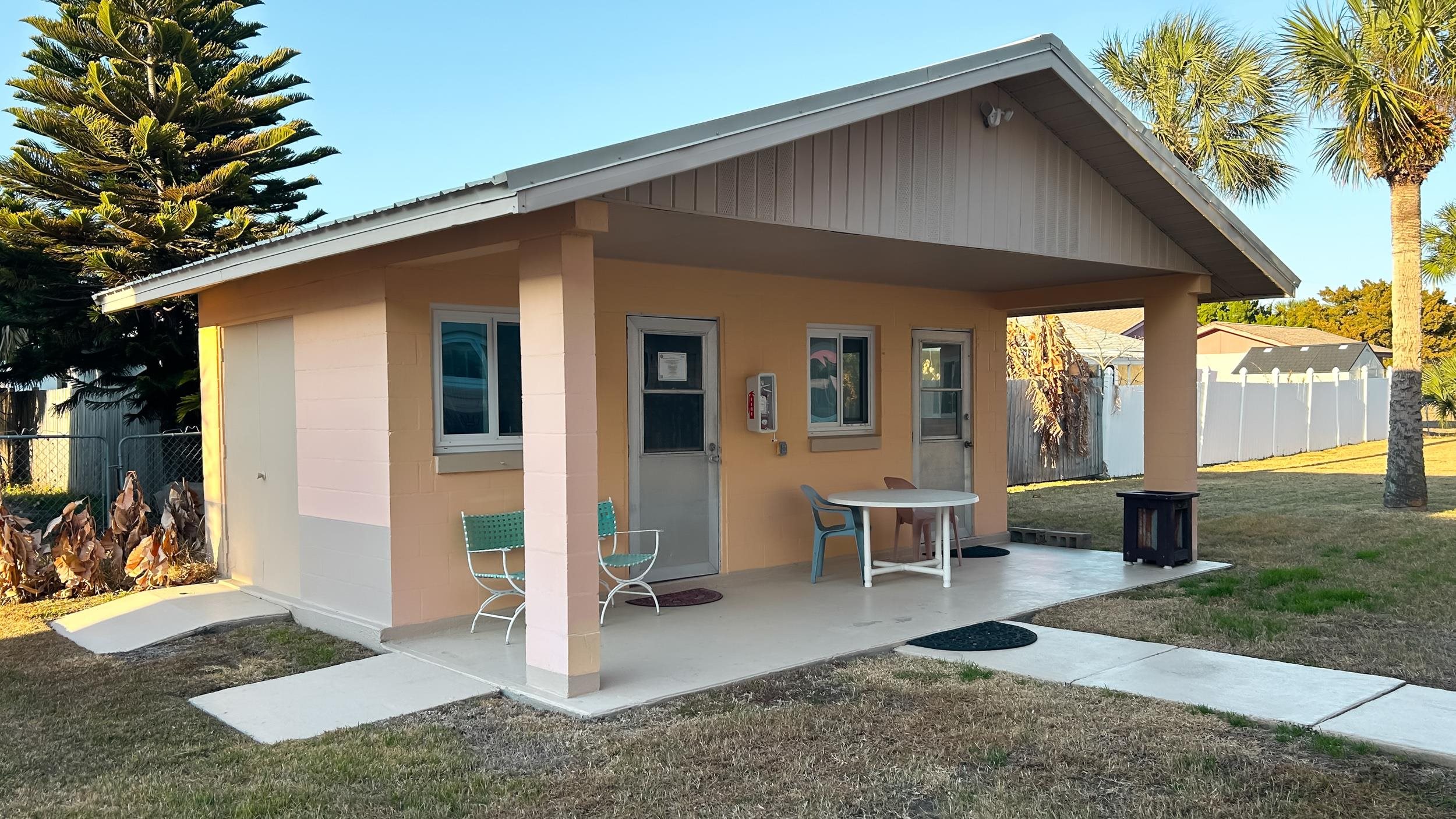 320 3rd Street North Flagler Beach, FL 32136 - Photo 23 of 29 a front view of a house with outdoor seating