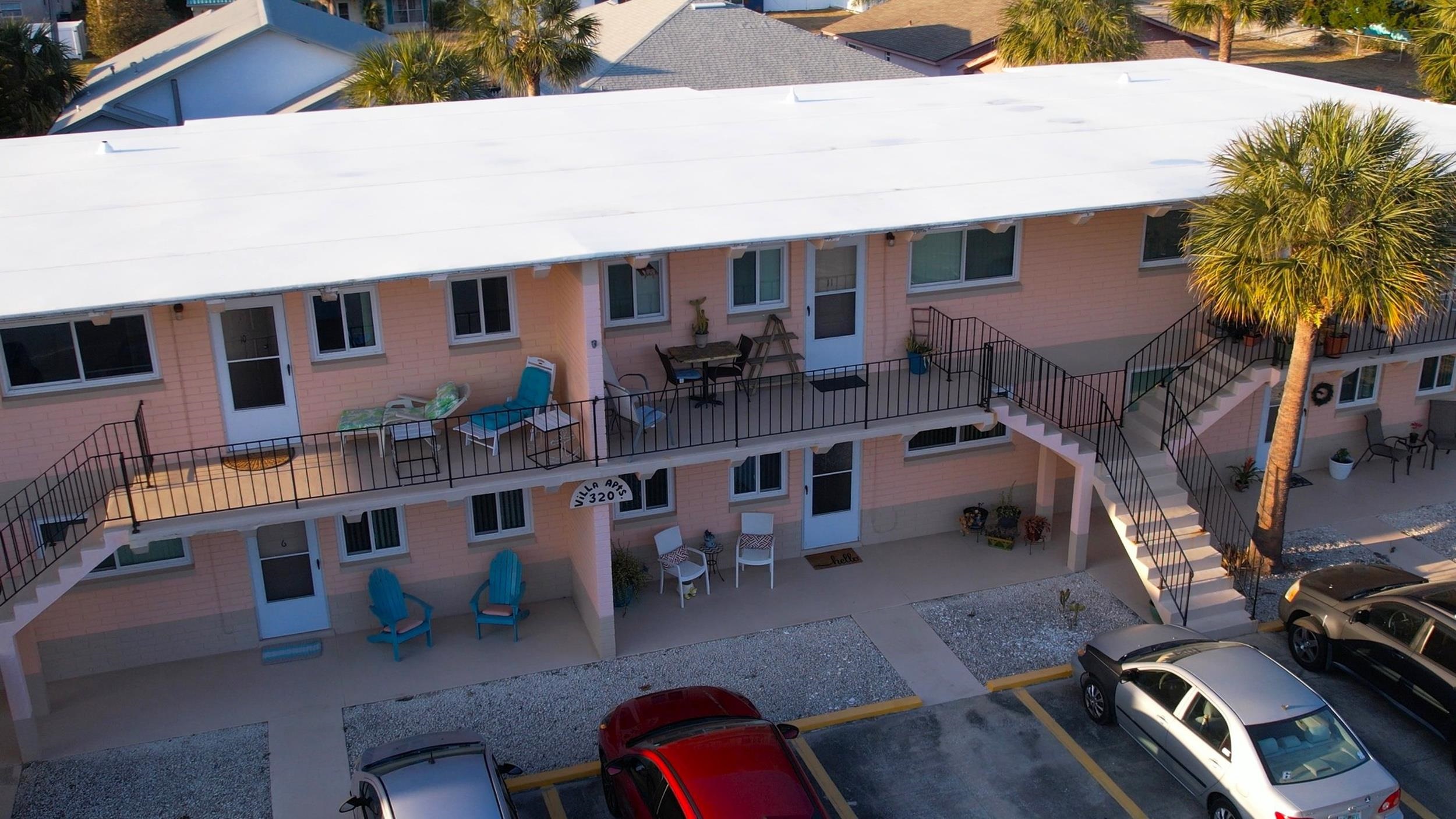 320 3rd Street North Flagler Beach, FL 32136 - Photo 5 of 29 a front view of a house with many windows