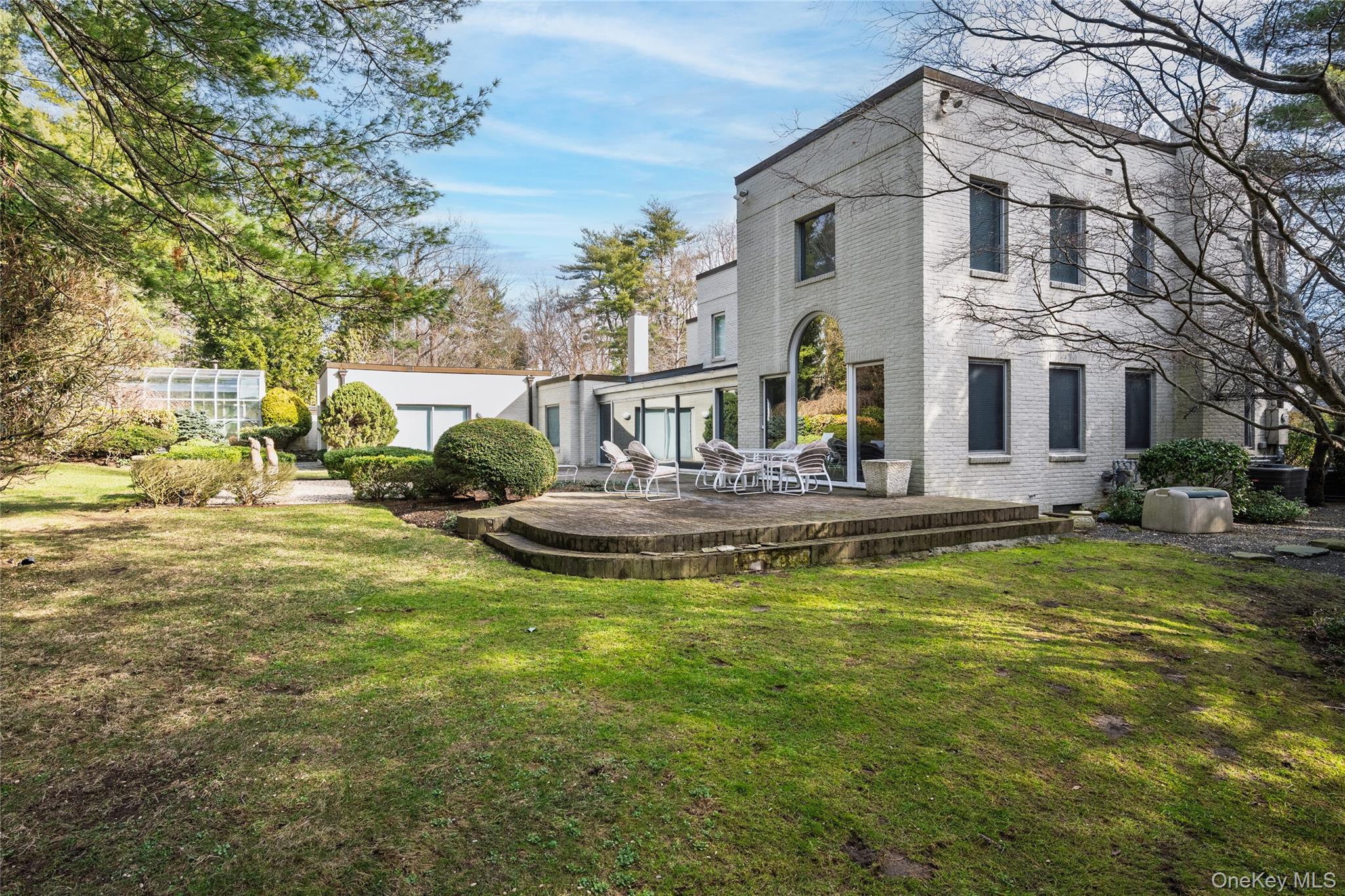 120 Bacon Road Old Westbury, NY 11568 - Photo 23 of 29 a house with swimming pool in front of it