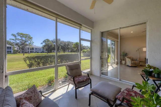 a balcony with furniture and garden view
