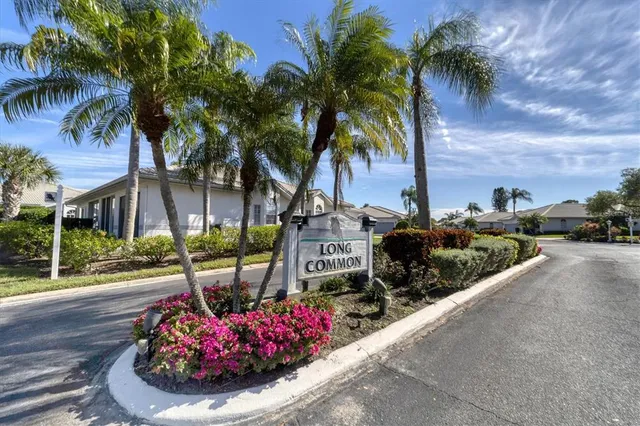 a swimming pool with outdoor seating and yard