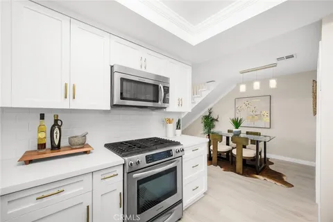 a kitchen with a stove and a microwave