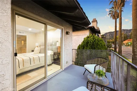 a view of balcony with furniture