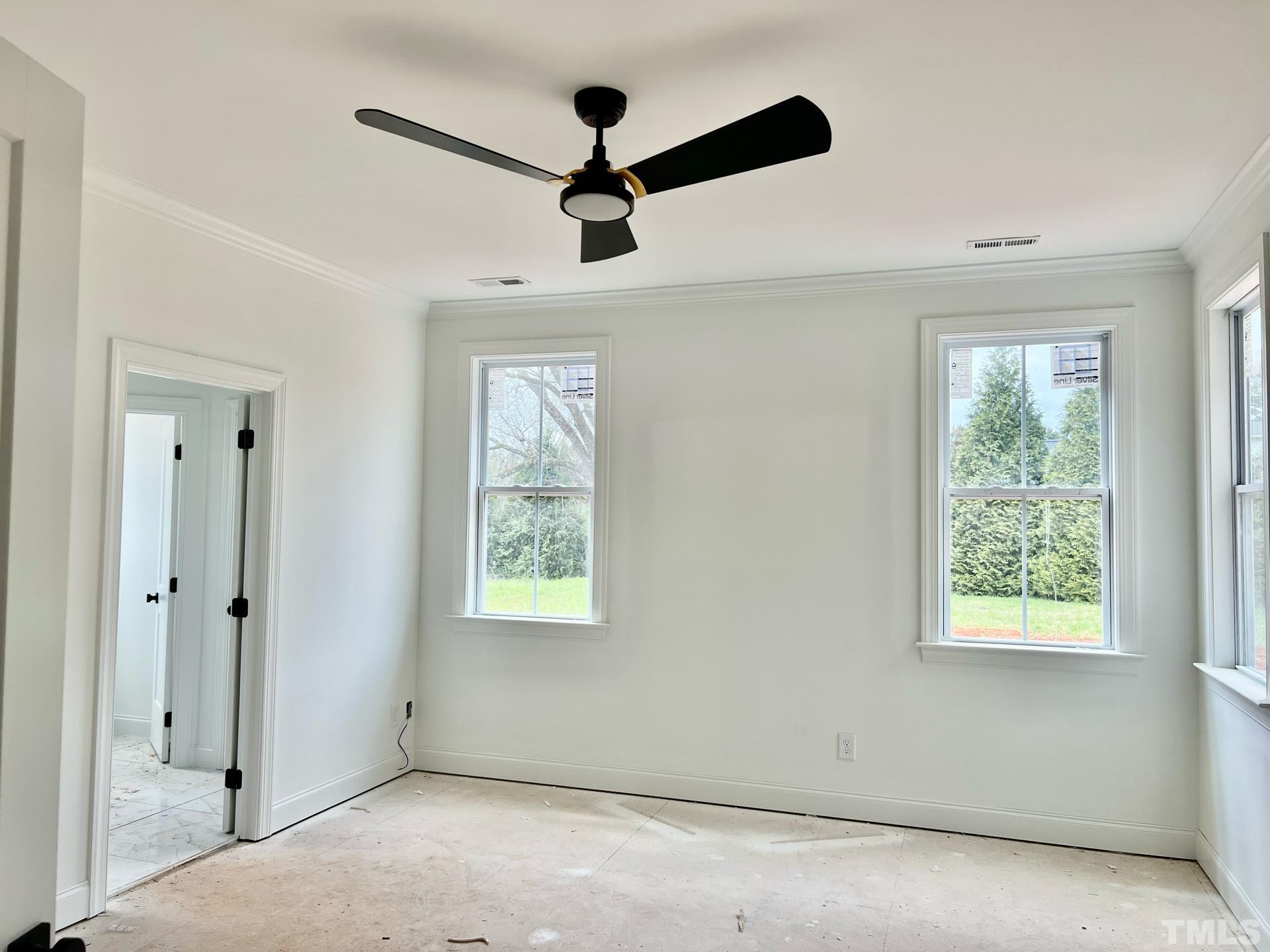 25 Tamaran Ct Spring Spring Hope, NC 27882 - Photo 9 of 40 a view of a livingroom with a ceiling fan & windows