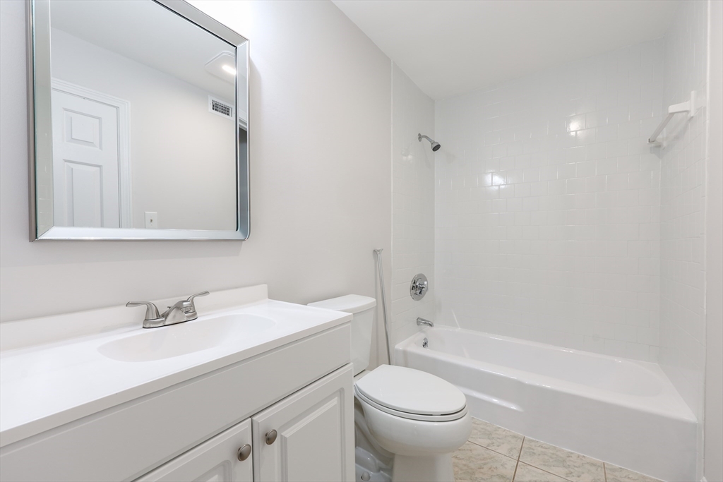 14 Shadowbrook Lane, Unit 30 Milford, MA 01757 - Photo 12 of 18 a bathroom with a sink a toilet and a bathtub